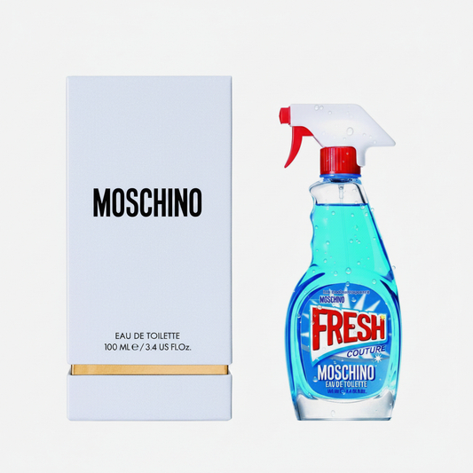 Moschino Fresh Couture Eau de Toilette 100ml - flacone blu trasparente a forma di spray con pistola rossa e confezione bianca su sfondo bianco